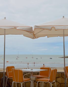 Enjoy a serene beach view from a cafe in Saint-Palais-sur-Mer, France.